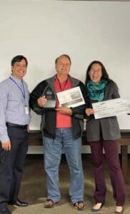 Tony gives quarterly awards to flight data systems employees for outstanding performance.